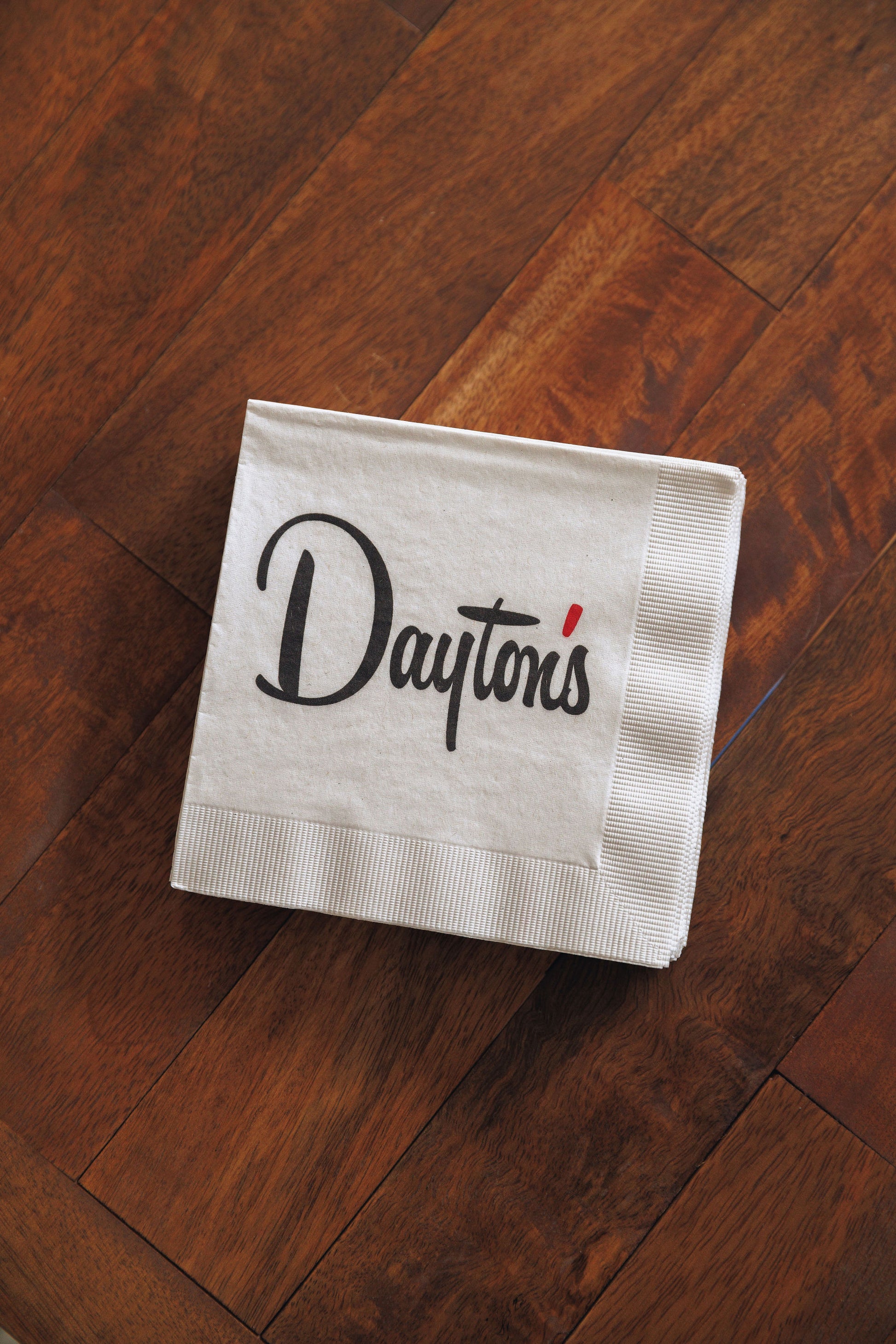 Dayton's napkin on a wooden surface