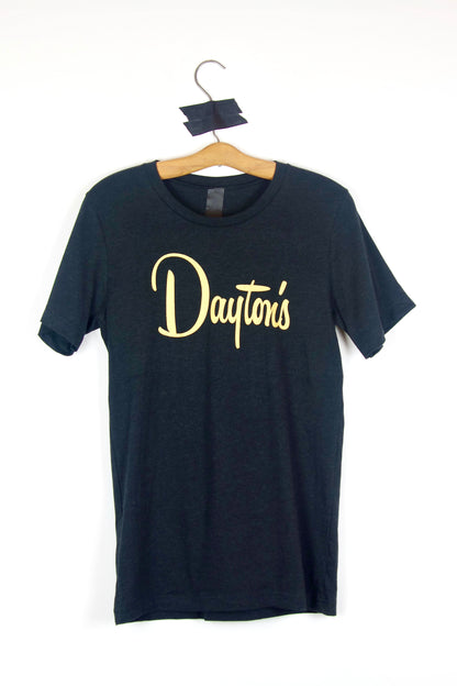 Black t-shirt with gold 'Dayton's' logo on a hanger against a white background