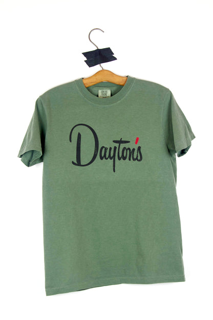Green t-shirt with 'Dayton's' text on a hanger against a white background